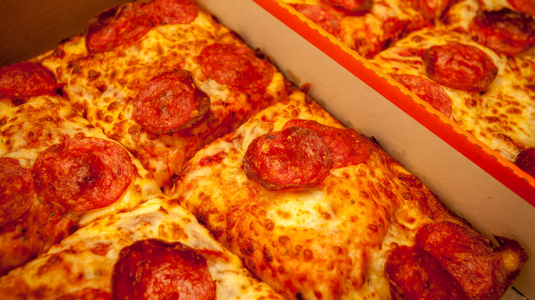 Square shaped pepperoni pizza in a pizza box