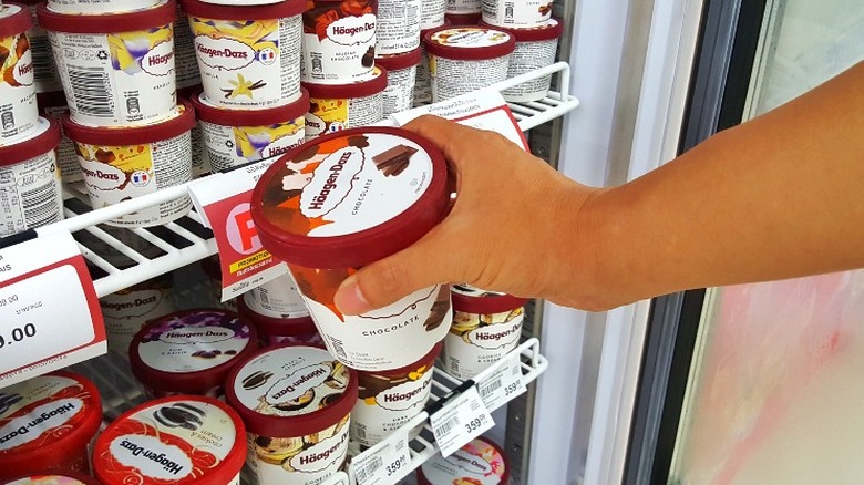 Hand selecting a pint of HAagen-Dazs