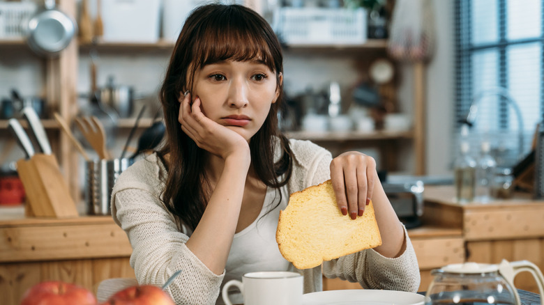 sad woman with bread