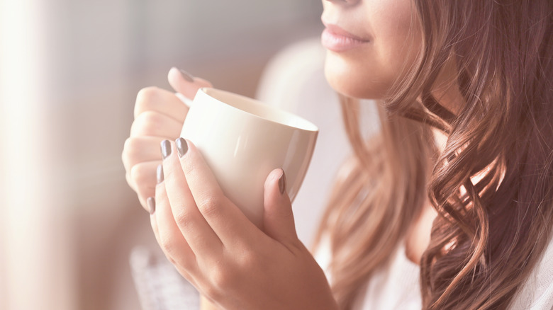 woman drinking coffee