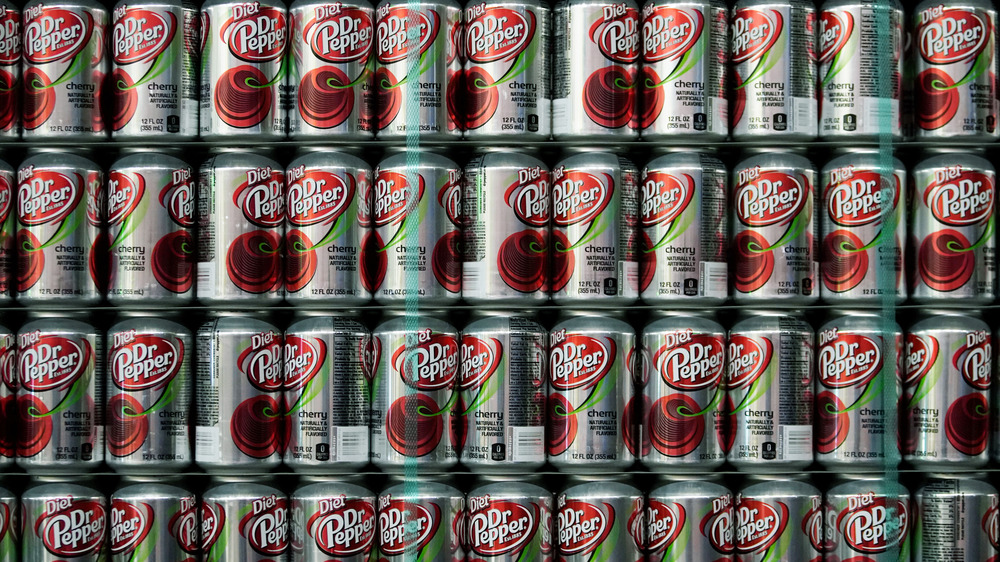 wall of diet cherry Dr. Pepper cans