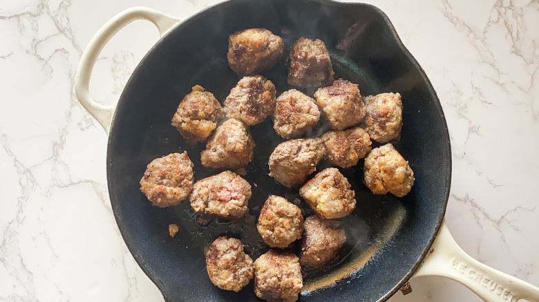 meatballs cooking in pan