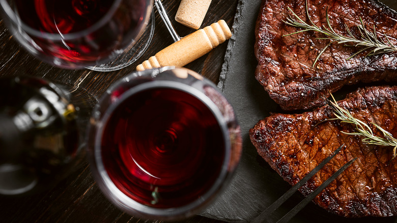 steak and glasses of red wine