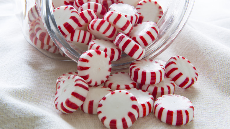 Peppermints spilling out of jar
