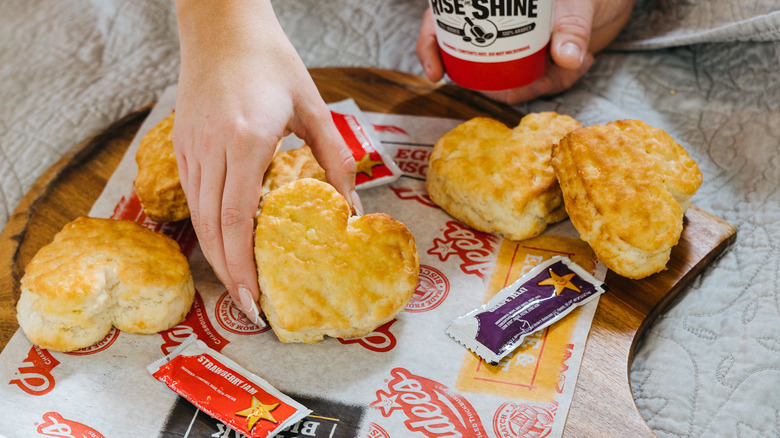 Hand holding Hardee's Heart Shaped Biscuit 