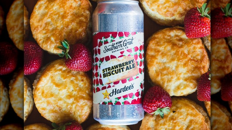 can of beer with biscuits and strawberries