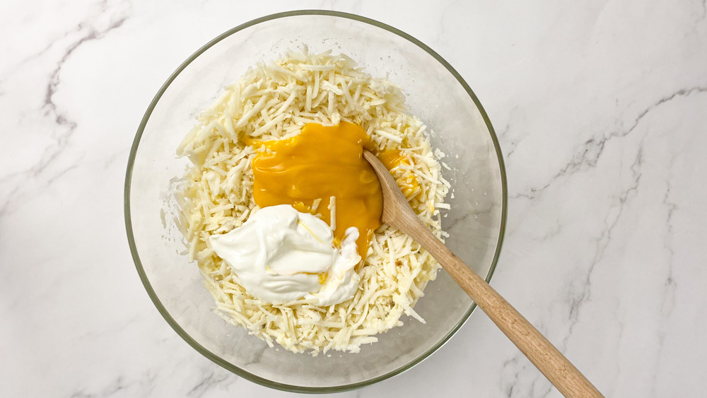 mixing wet ingredients for hashbrown casserole