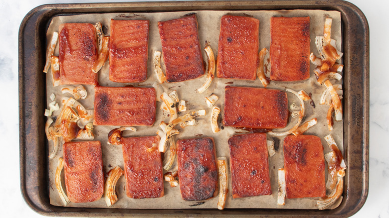 Broiled spam and onions on baking sheet