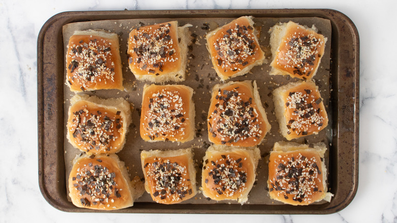 Rolls with seasoning on baking sheet