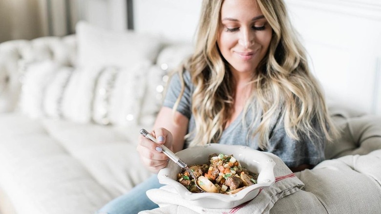 Haylie Duff holding a bowl of food