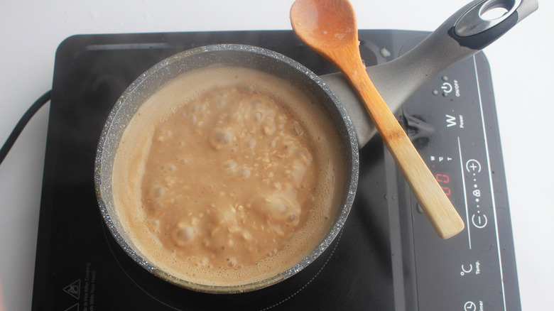 Coffee oatmeal in pan on stove