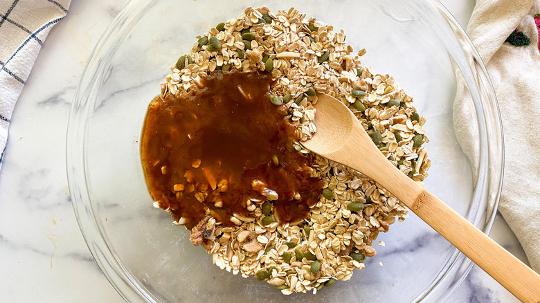 mixing granola ingredients