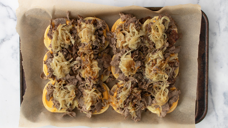 Slider rolls with sliced steak and onions