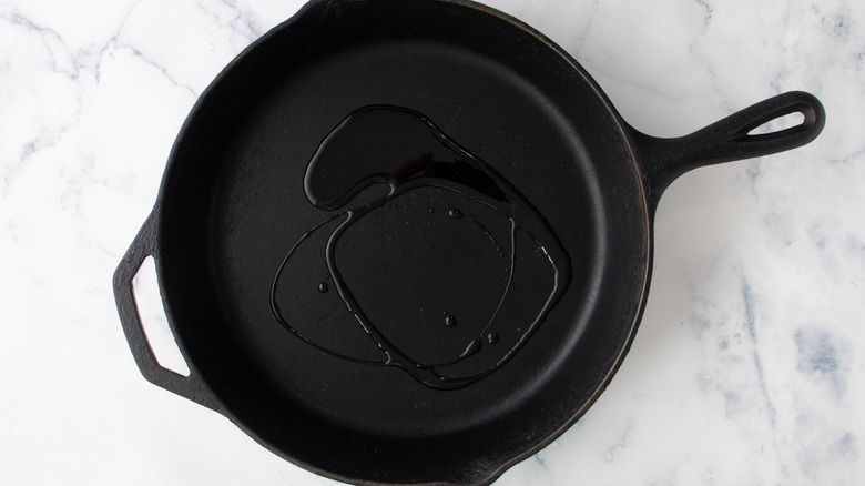 Oil in black frying pan