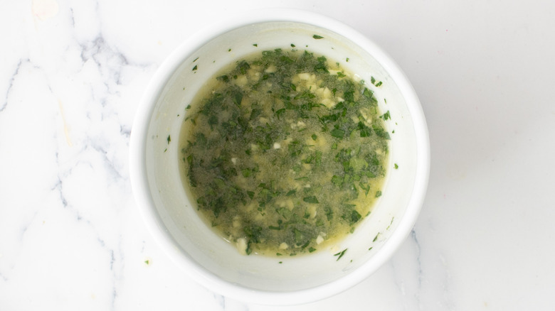 Green and yellow liquid in white bowl