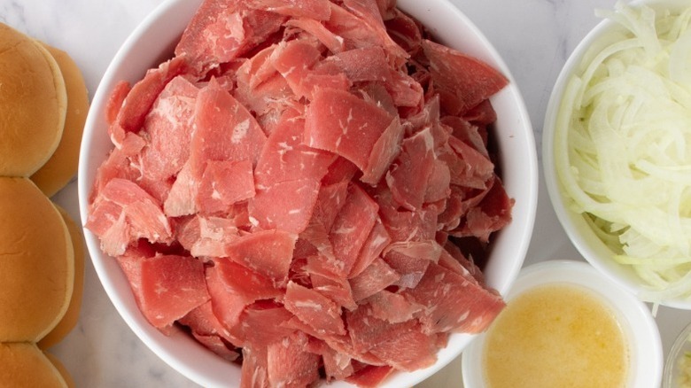 Sliced beef in a white bowl