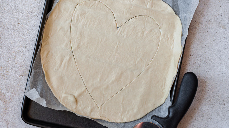 heart cut in pizza dough 