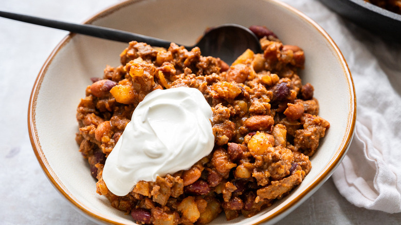 bowl of chili with sour cream