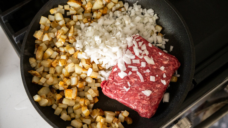 potatoes, onion, beef in skillet