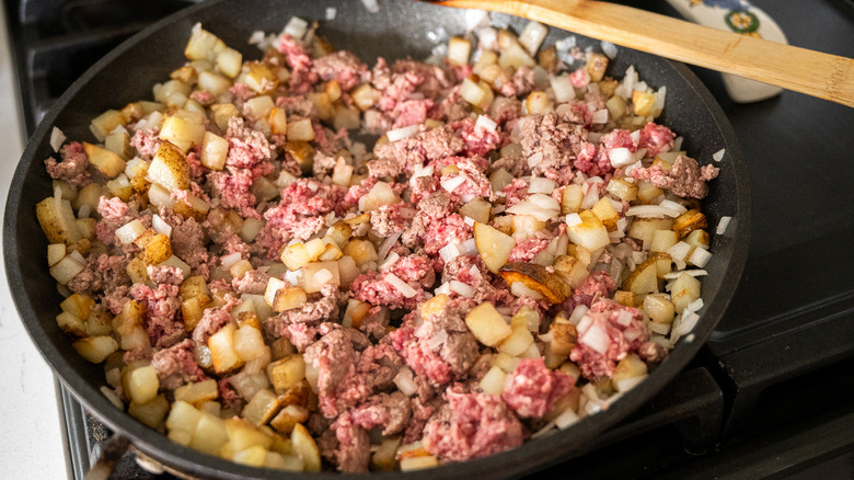 beef and potatoes in pan