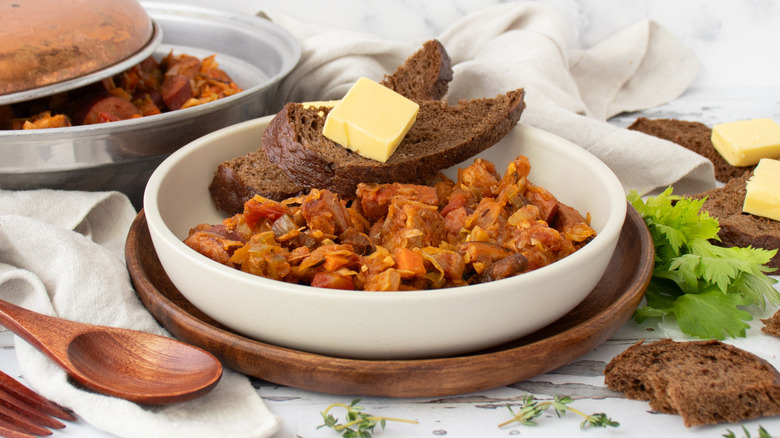 stew in bowl with bread