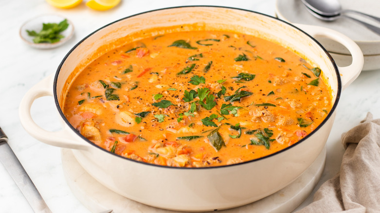 Creamy sausage and gnocchi soup in casserole pot