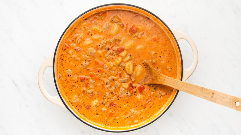 Sausage and gnocchi soup in casserole pot