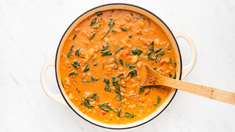 Sausage and gnocchi soup in casserole pot