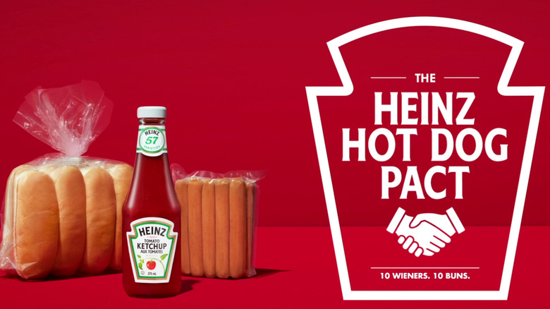 Heinz Hot Dog Pact package of hot dogs and package of buns next to Heinz ketchup bottle on red background