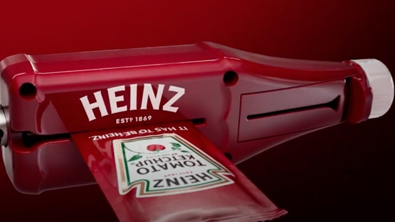 Plastic ketchup packet roller with ketchup packet