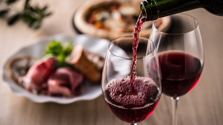 pouring red wine with dinner