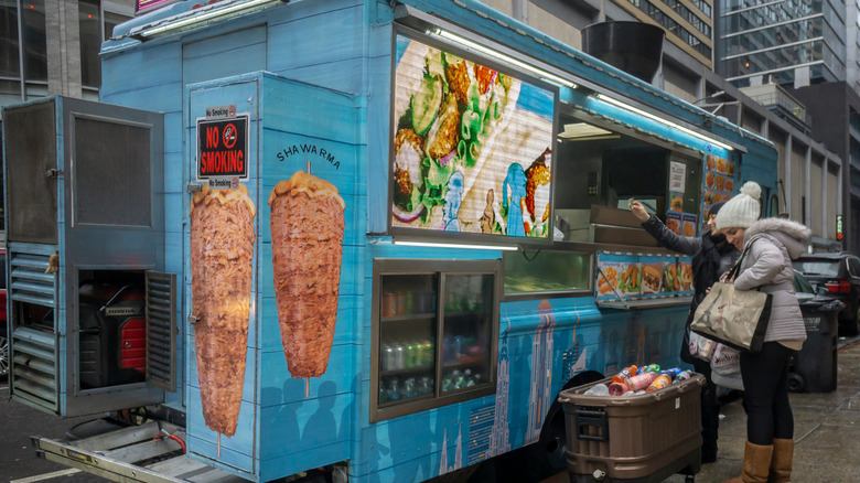 People shopping at a food truck