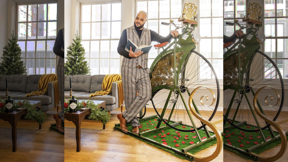 Man standing in front of the Hendrick's Gin High Wheel stationary bike