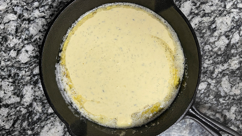 Raw Dutch baby batter in skillet