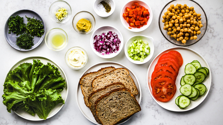 chickpea salad sandwich ingredients on table