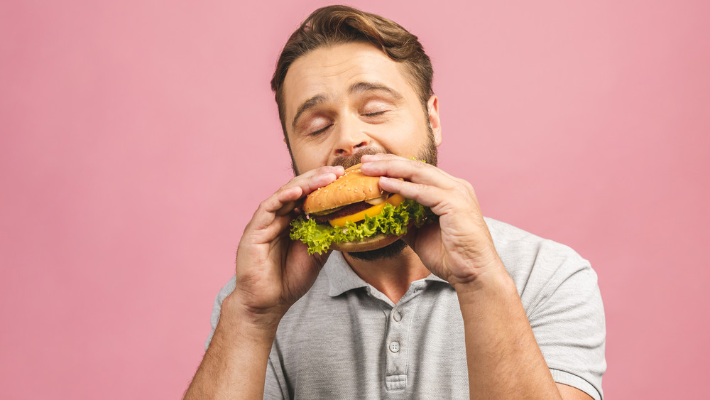 Man eating hamburger