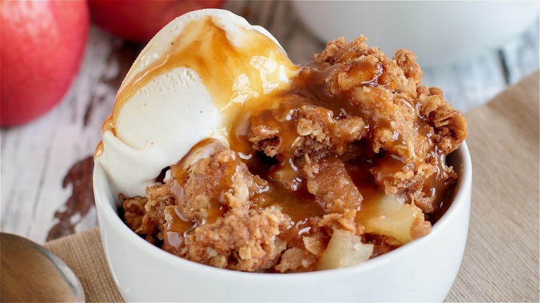 Apple crisp with ice cream in a bowl