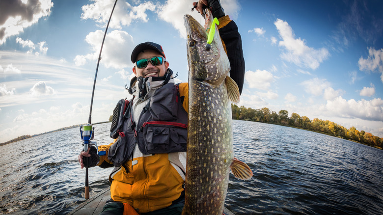 Fisherman holding a fish