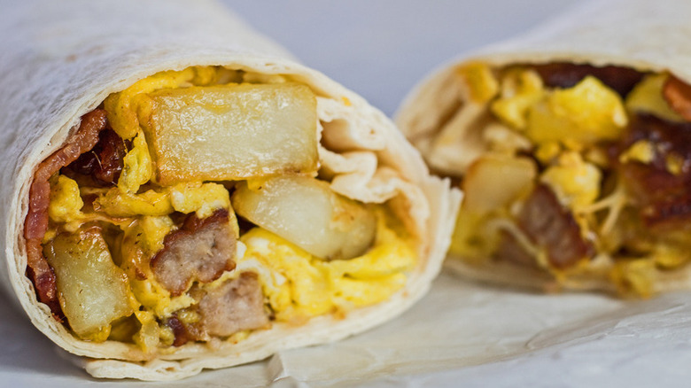 Tortilla wrap filled with sausage, egg, and potato. 