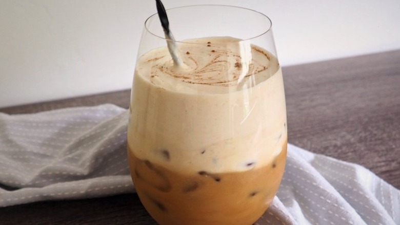 Layered coffee and cream drink with cinnamon swirl