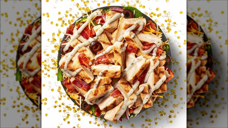 Subway chicken bowl with gold and white confetti