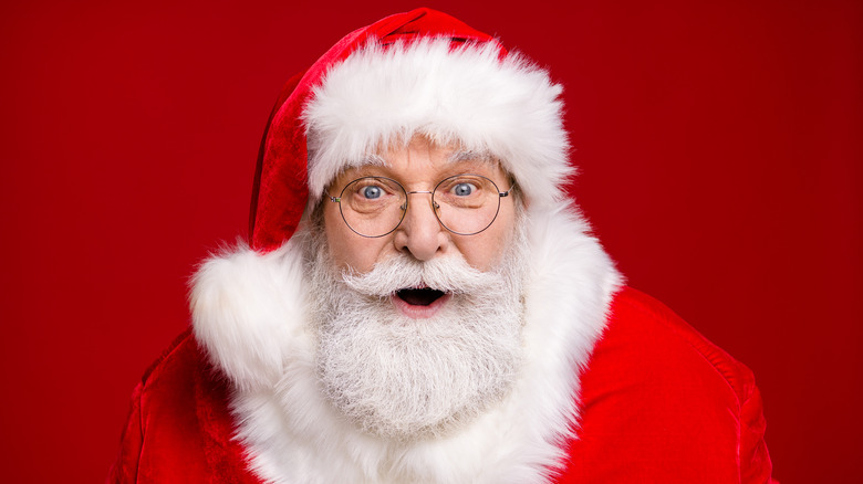 Santa smiling, wearing glasses