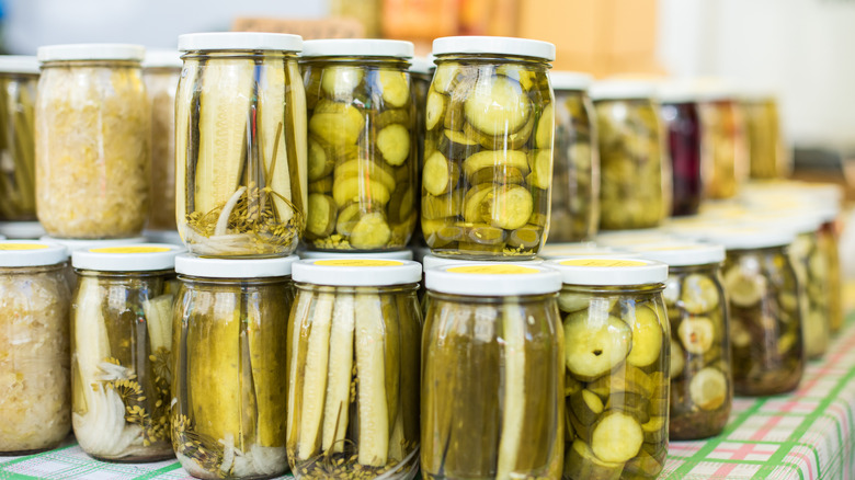 collection of dill pickle jars 