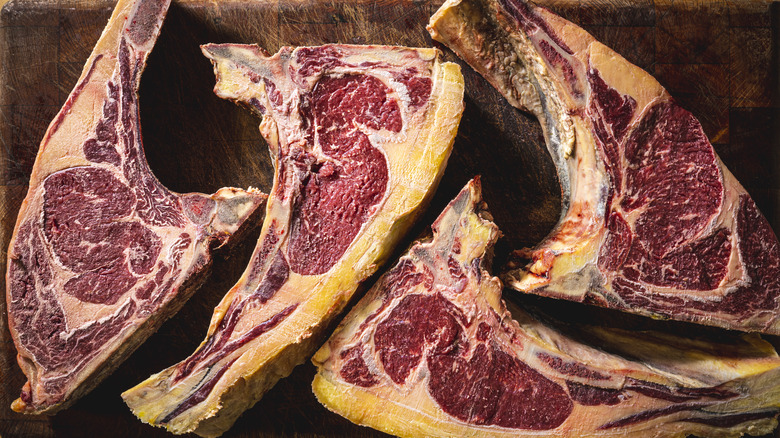 aged steak cuts on board