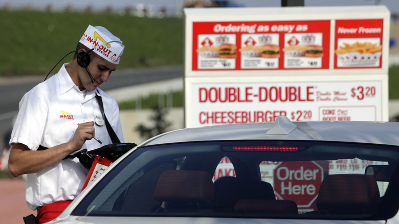 In-N-Out Burger employee taking orders