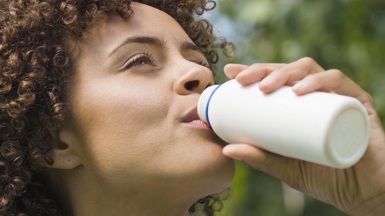 Woman drinking kefir