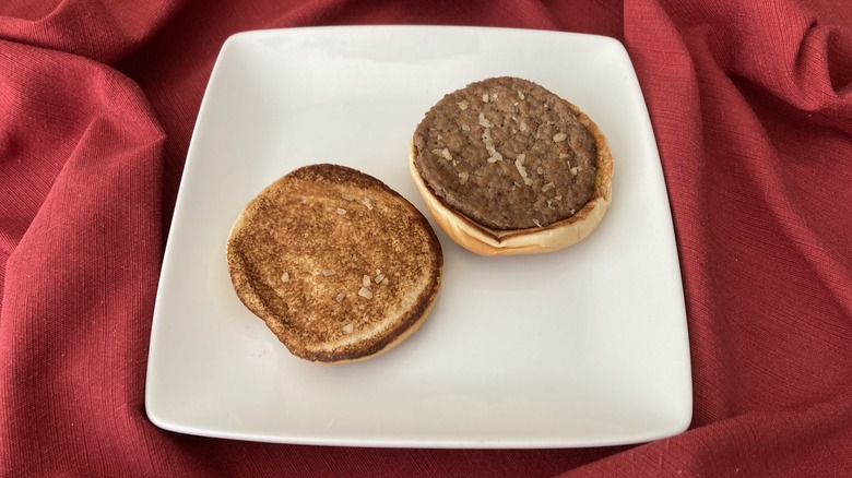 McDonalds hamburger open on plate