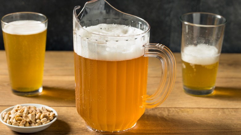 Pitcher of beer and glasses