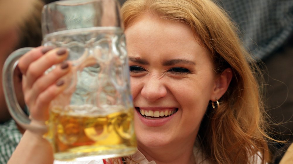 Woman smiling with beer stein