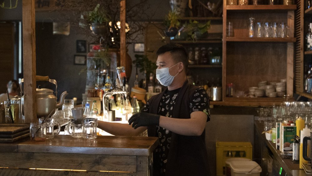 Restaurant staff member wearing mask